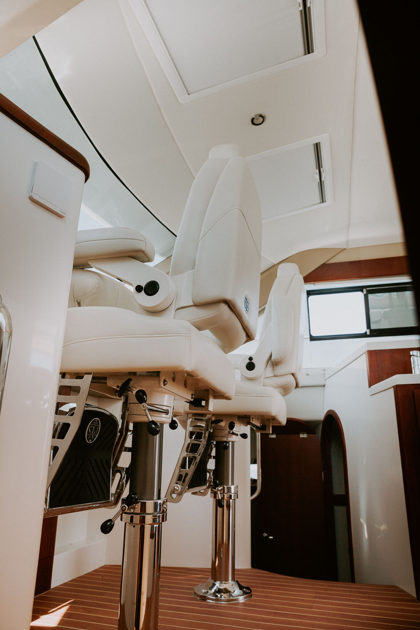 dual helm seats in a cabin boat